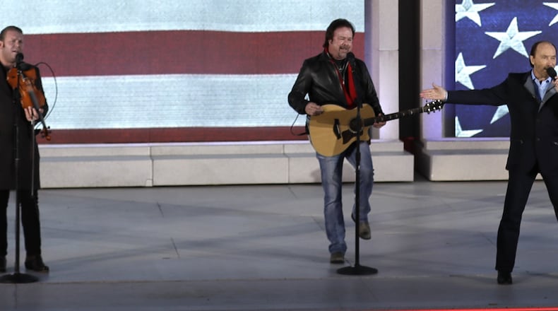 Donnie Reis, left, performs with Lee Greenwood, right,  at a pre-Inaugural “Make America Great Again! Welcome Celebration” at the Lincoln Memorial in Washington, Thursday, Jan. 19, 2017. (AP Photo/David J. Phillip)