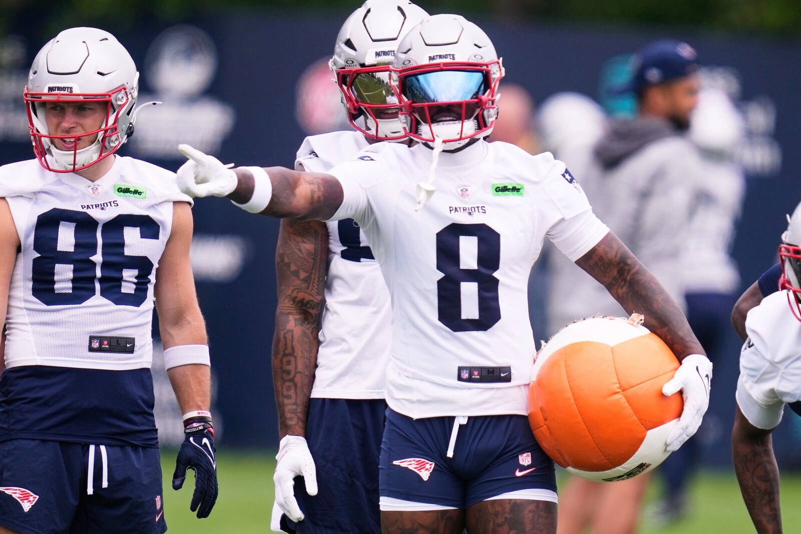 New England Patriots wide receiver Stefon Diggs prepares to run a drill with a heavy ball during an NFL football practice, Monday, June 9, 2025, in Foxborough, Mass. (AP Photo/Charles Krupa)