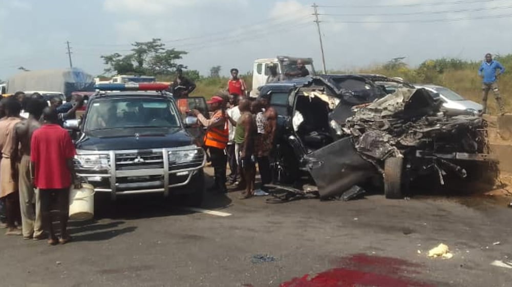 In this photo provided by the Federal Road Safety Corps, people gather at the accident scene of British boxer Anthony Joshua in Lagos, Nigeria, on Monday, Dec. 29, 2025. (Federal Road Safety Corps via AP)