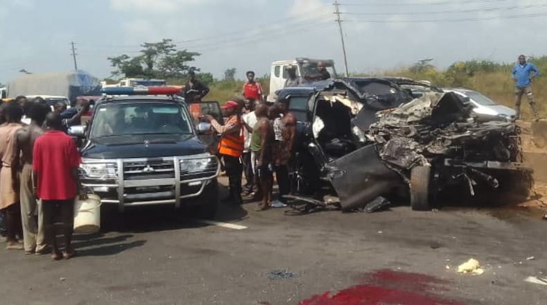 In this photo provided by the Federal Road Safety Corps, people gather at the accident scene of British boxer Anthony Joshua in Lagos, Nigeria, on Monday, Dec. 29, 2025. (Federal Road Safety Corps via AP)