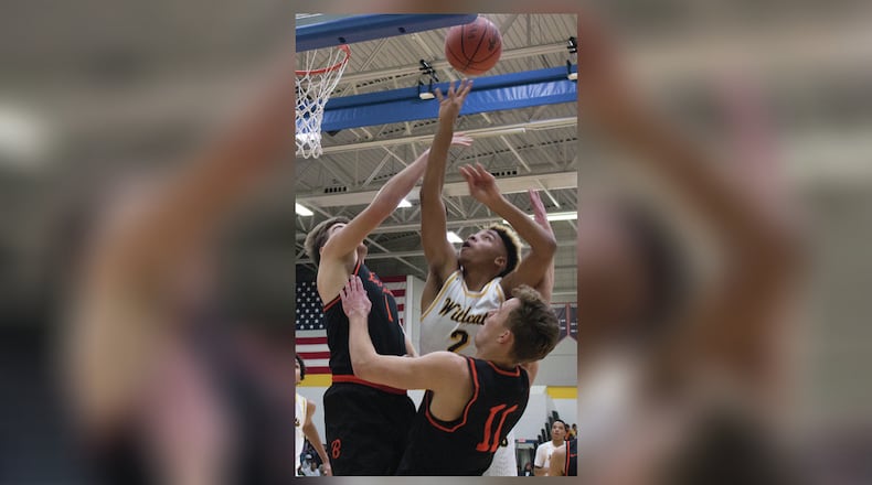 Springfield’s Jordan Howard scores inside over Beavercreek’s Adam Graeter, left, and Jon Alessandro. Jeff Gilbert/CONTRIBUTED