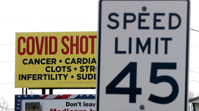 A billboard along Upper Valley Pike that tells people COVID vaccinations cause health issues has drawn fire from Clark County health officials, who refute the claims made. BILL LACKEY/STAFF