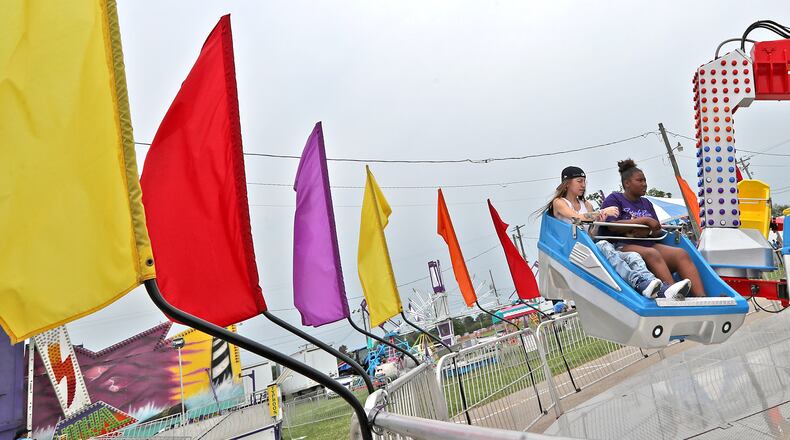 Jai Dean, left, and Montasia Suttles ride the Xtreme ride at the Clark County Fair Friday. BILL LACKEY/STAFF