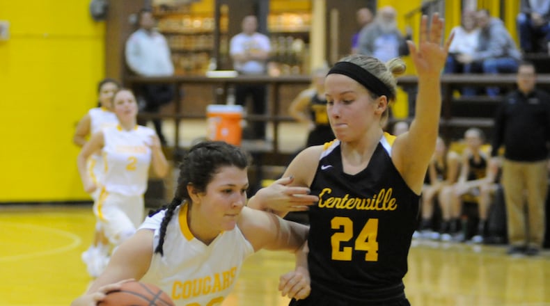Kenton Ridge’s Mallery Armentrout (with ball) is confronted by Centerville’s Kelsey George. Centerville defeated host Kenton Ridge 61-46 in a girls high school basketball game on Thursday, Jan. 3, 2019. MARC PENDLETON / STAFF