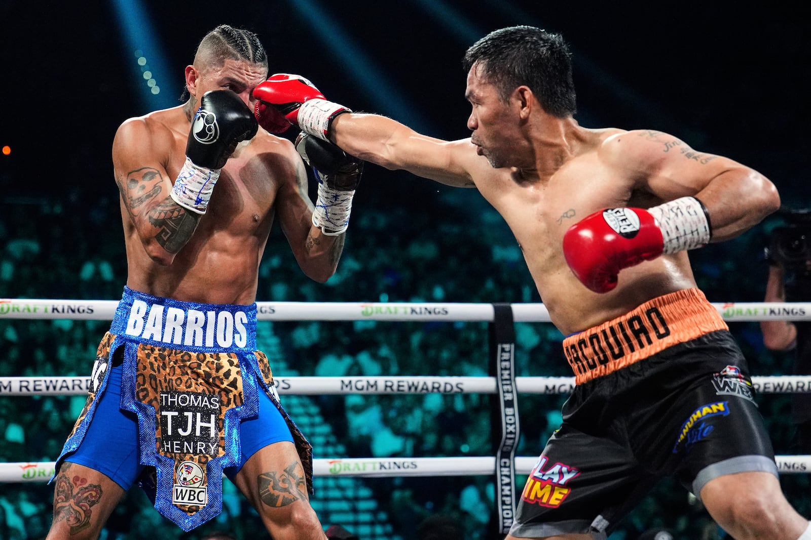 Mario Barrios, left, fights Manny Pacquiao in a welterweight title boxing match Saturday, July 19, 2025, in Las Vegas. (AP Photo/John Locher)