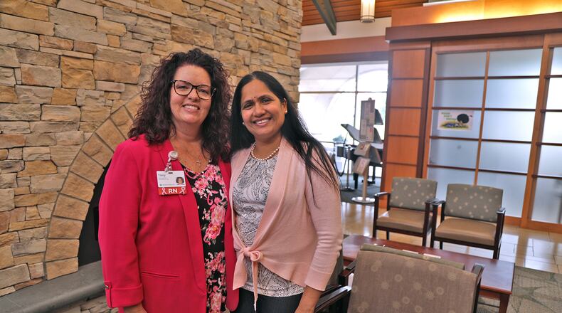 Tracy Adrian, a Breast Health Navigator with MercyHealth, left, and Dr. Jyothi Challa, an oncologist with MercyHealth, an the Springfield Cancer Center Tuesday, Sept. 27, 2022. BILL LACKEY/STAFF