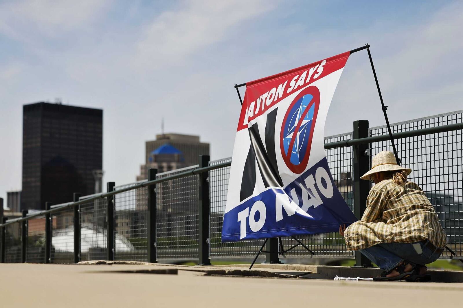 Protestors gathered at Deeds Point in Dayton across the Great Miami River from the security zone of the NATO Parliamentary Assembly on Saturday, May 24, 2025. NICK GRAHAM / STAFF