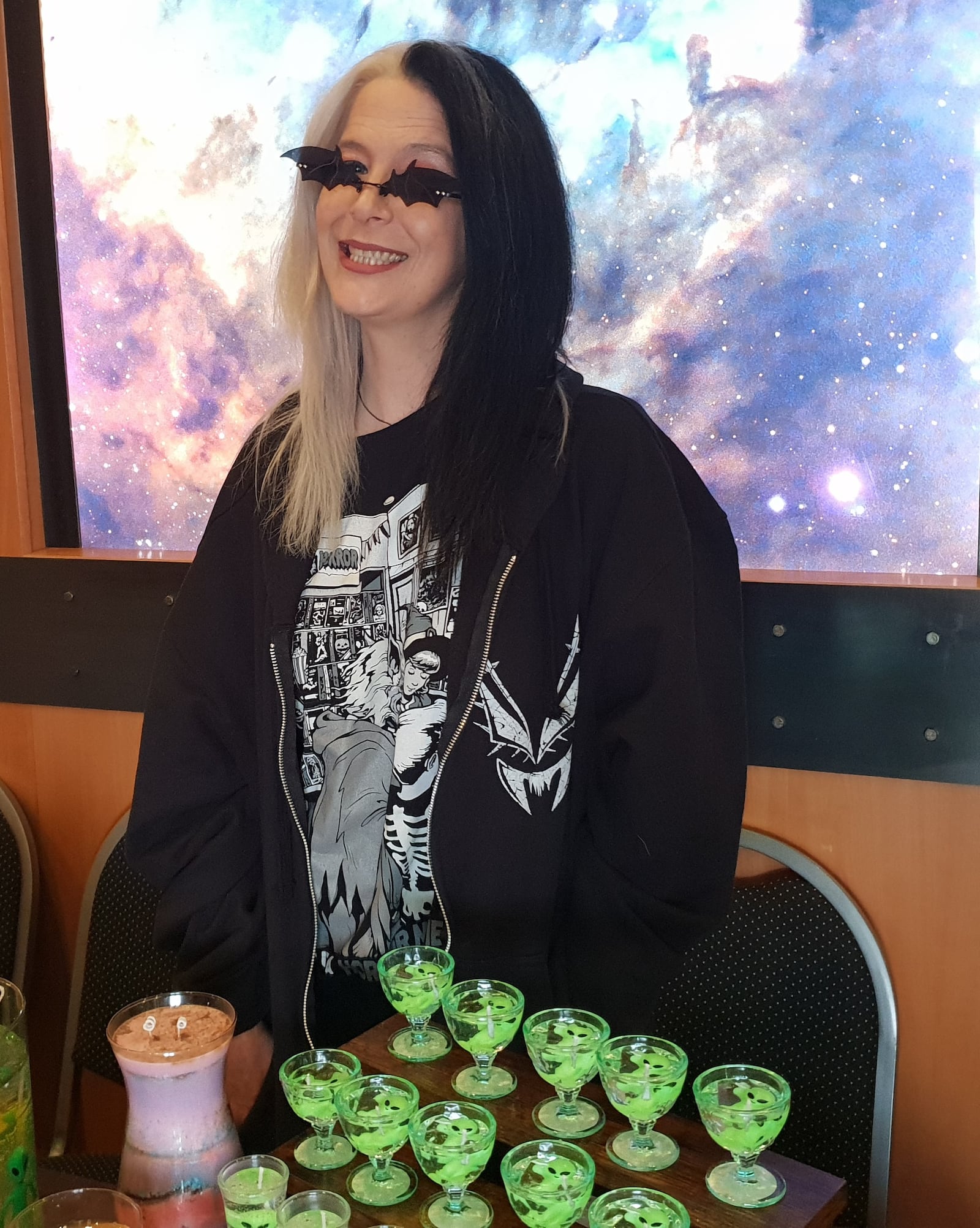 Owner of Phantom Flame Candles Kim Ashworth poses next to some of her wares.