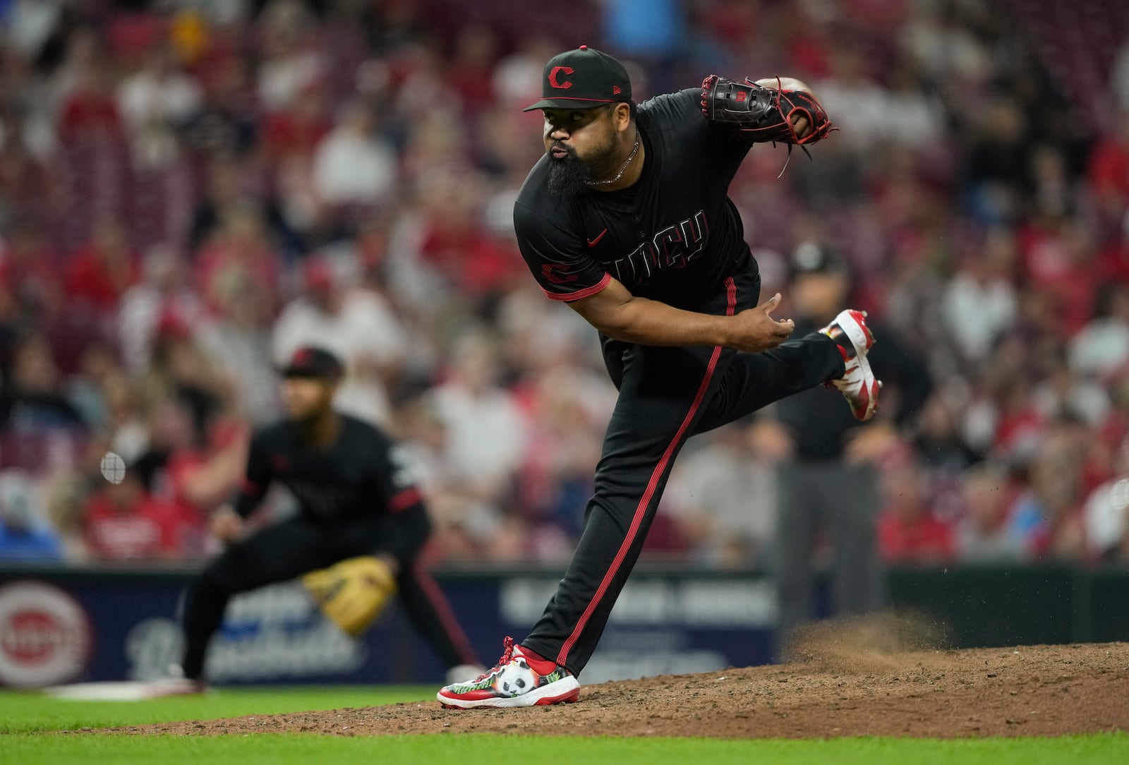 Cincinnati Reds pitcher Tony Santillan throws during the tenth inning of a baseball game against the St. Louis Cardinals Friday, Aug. 29, 2025, in Cincinnati. (AP Photo/Carolyn Kaster)
