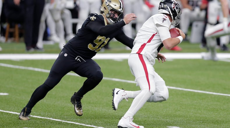 File-This Nov. 22, 2020, file photo shows New Orleans Saints defensive end Trey Hendrickson (91) sacking Atlanta Falcons quarterback Matt Ryan (2) in the first half of an NFL football game in New Orleans. After free agent Carl Lawson signed with the Jets, the Bengals hoped to bolster their pass rush by picking up Hendrickson, an edge rusher who logged 13.5 sacks with the Saints last year.  (AP Photo/Brett Duke, File)