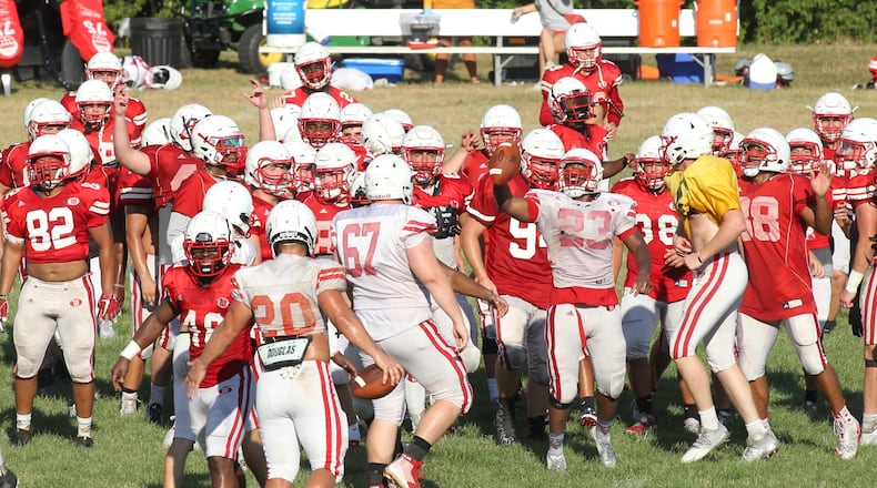 Wittenberg players run to a huddle during practice on Wednesday, Aug. 21, 2019, in Springfield. David Jablonski/Staff