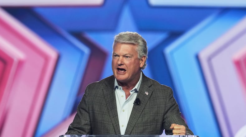 FILE - Rep. Mike Collins, R-Ga., speaks during Turning Point USA's AmericaFest 2025 on Dec. 20, 2025, in Phoenix. (AP Photo/Ross D. Franklin, File)