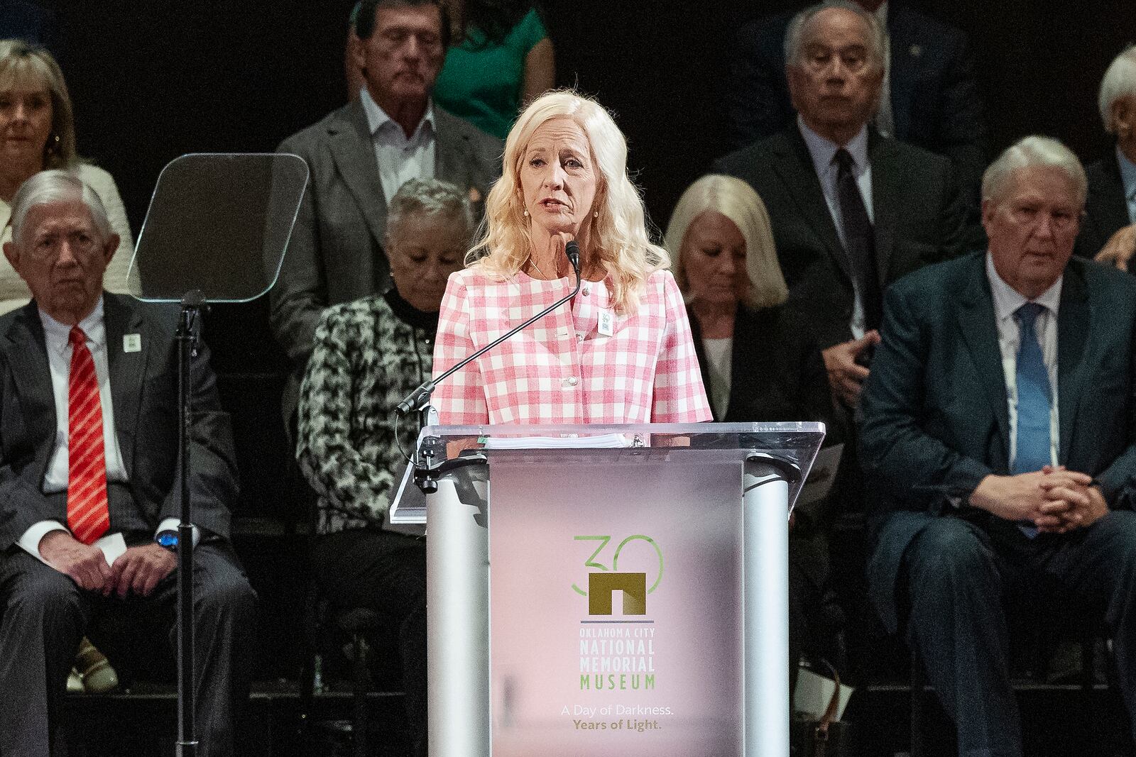Dr. Susan Chambers welcomes guest, family and friends during the 30th anniversary memorial service for the victims of the 1995 Oklahoma City bombing, in Oklahoma City, Saturday, April 19, 2025. (AP Photo/Alonzo Adams)