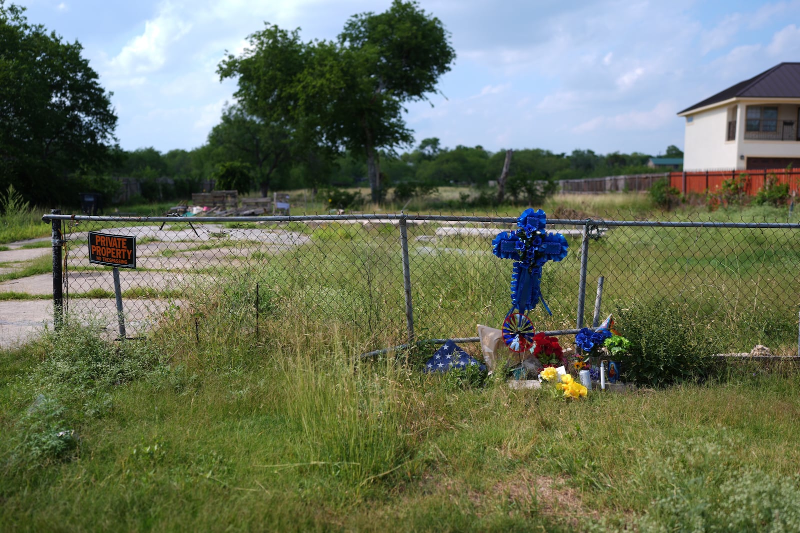 Candles, flowers, and notes make up make-shift memorial for voice actor Jonathan Joss who was recently killed, Tuesday, June 3, 2025, in San Antonio. (AP Photo/Eric Gay)