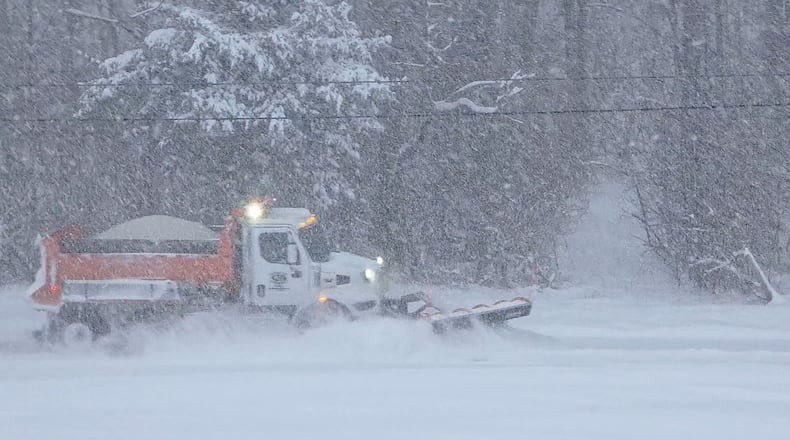A Butler County Engineer's Office truck plows snow from Elk Creek Road Sunday morning, Jan. 25, 2026 in Madison Township. NICK GRAHAM/STAFF