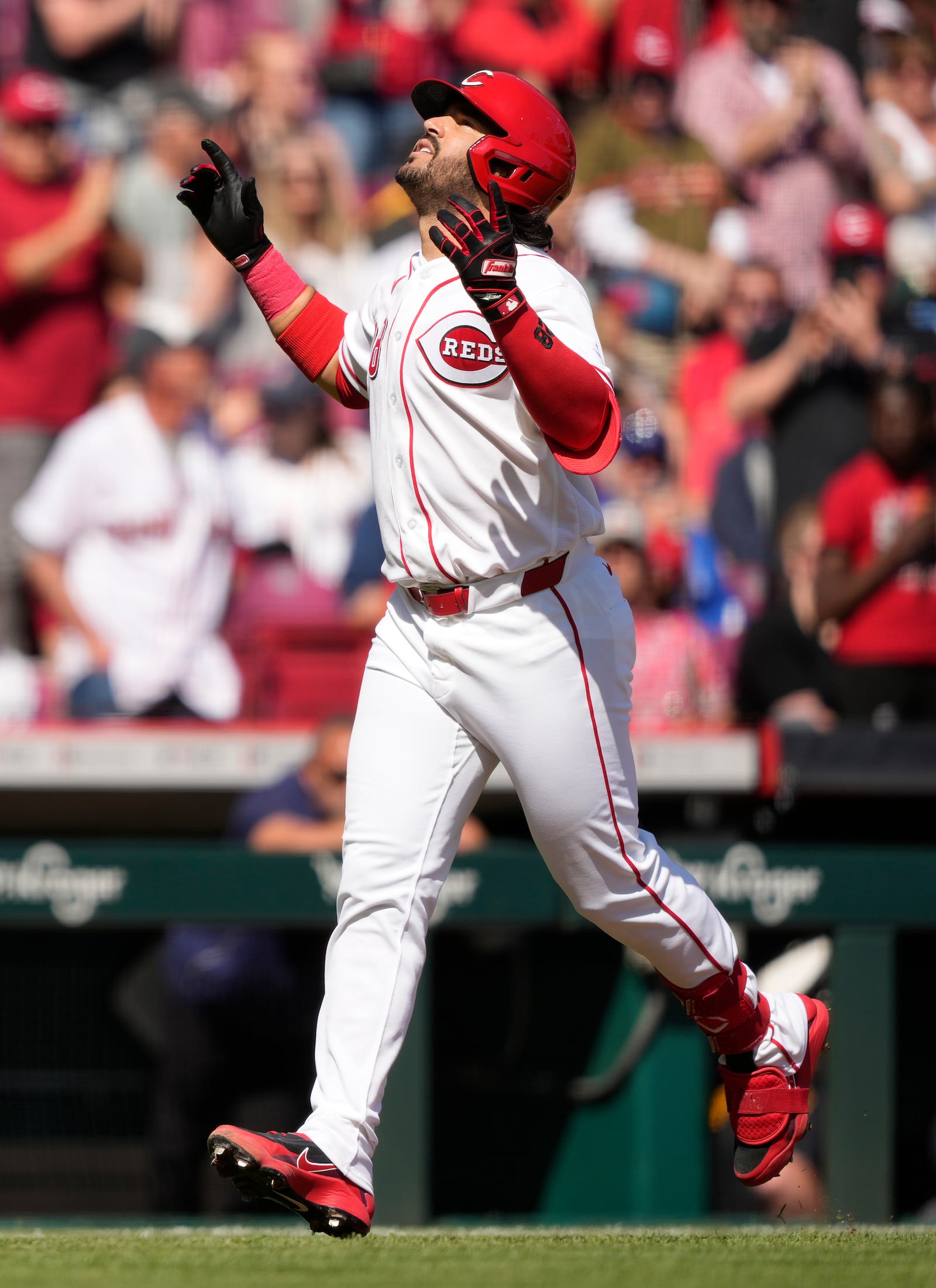 Cincinnati Reds' Eugenio Suárez celebrates as he rounds the bases after hitting a three-run homer during the sixth inning of a baseball game against the Boston Red Sox in Cincinnati, Sunday, March 29, 2026. (AP Photo/Carolyn Kaster)