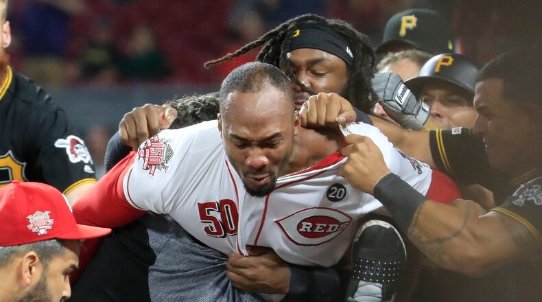 CINCINNATI, OHIO - JULY 30: Amir Garrett #50 (middle white shirt with out hat) of the Cincinnati Reds engages members of the Pittsburgh Pirates during a bench clearing altercation in the 9th inning of the game at Great American Ball Park on July 30, 2019 in Cincinnati, Ohio. (Photo by Andy Lyons/Getty Images)