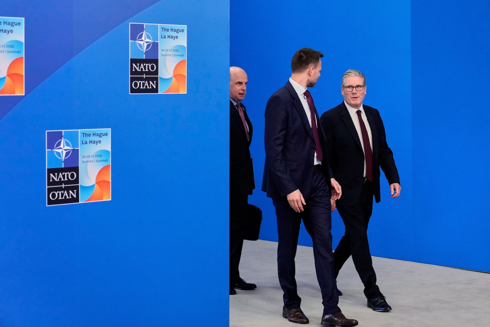 Britain's Prime Minister Keir Starmer, right, arrives for the NATO summit in The Hague, Netherlands, Wednesday, June 25, 2025. (AP Photo/Matthias Schrader)