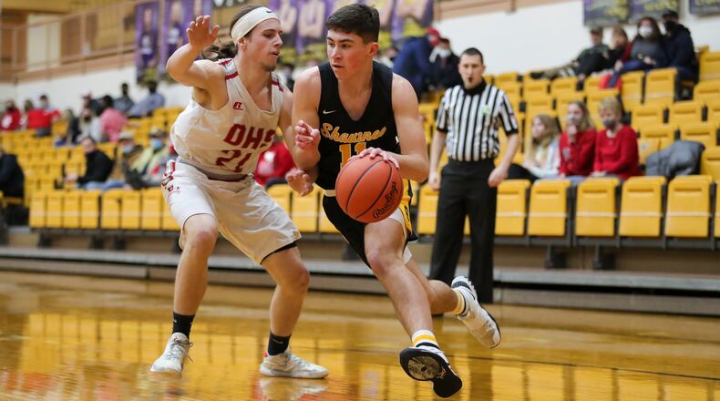 Shawnee High School sophomore R.J. Griffin drives past Dixie junior Jimmy Myers during their game on Thursday night at the Vandalia Butler Student Activities Center. The Braves won 77-45. Michael Cooper/CONTRIBUTED