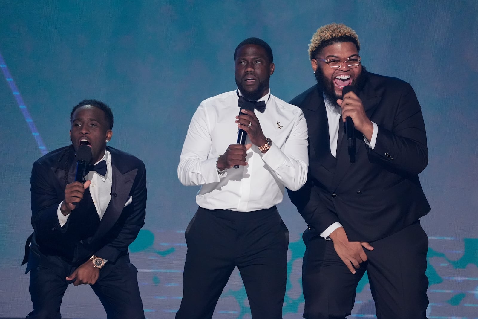 Kai Cenat, from left, Host Kevin Hart and Druski speak during the BET Awards on Monday, June 9, 2025, at the Peacock Theater in Los Angeles. (AP Photo/Chris Pizzello)