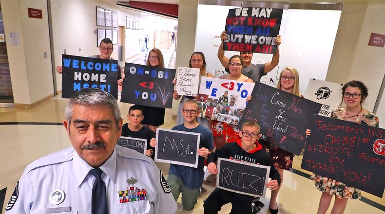 Master Sgt. Antonio Ruiz with some of his ROTC students at Tecumseh High School. BILL LACKEY/STAFF
