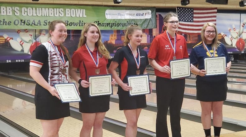 Springfield High School junior Ashley Falke, right, holds her state award after winning the Division I OHSAA State Bowling individual championship on Saturday, March 7, at Wayne Webb’s Columbus Bowl. CONTRIBUTED PHOTO