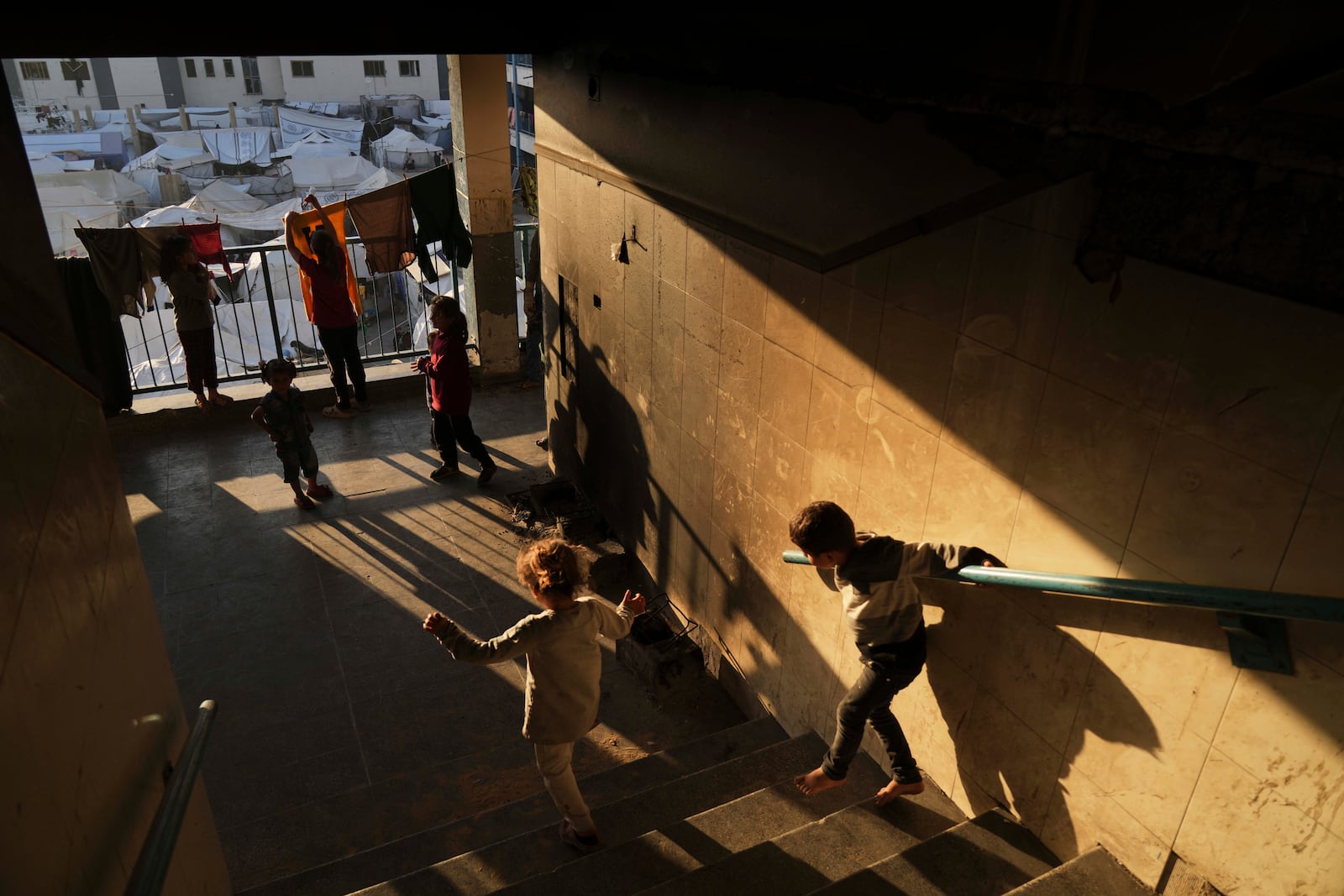 Displaced Palestinians live in a school that has been converted into a shelter in Gaza City amid the ongoing war in Gaza, Tuesday, May 6, 2025. (AP Photo/Jehad Alshrafi)