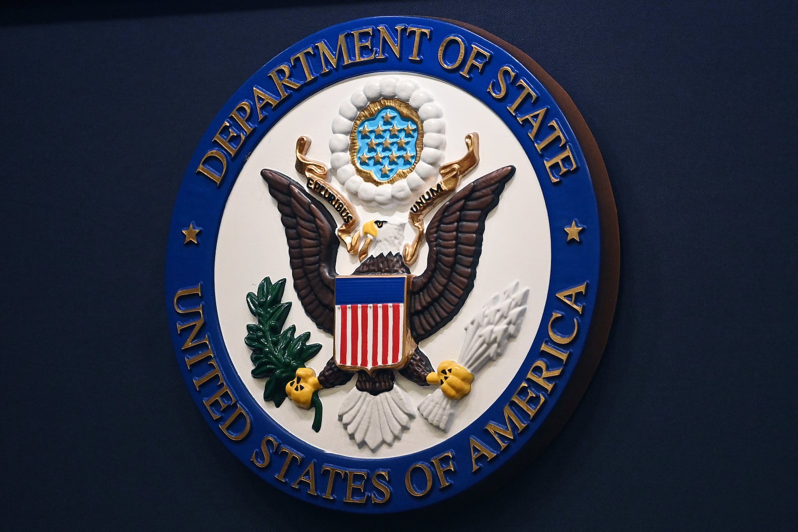 FILE - The State Department seal is seen on the briefing room lectern at the State Department in Washington, Jan. 31, 2022.(Mandel Ngan, Pool via AP, File)