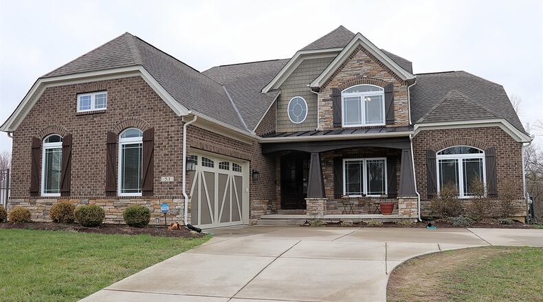 Listed for $619,900, the brick-stone-and-cedar home at 51 Ruppert Court has about 5,084 square feet of living space. Contributed photos by Kathy Tyler