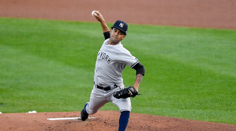 New York Yankees starting pitcher Deivi Garcia throws to a Toronto Blue Jays batter during the first inning of a baseball game in Buffalo, N.Y., Wednesday, Sept. 9, 2020. (AP Photo/Adrian Kraus)