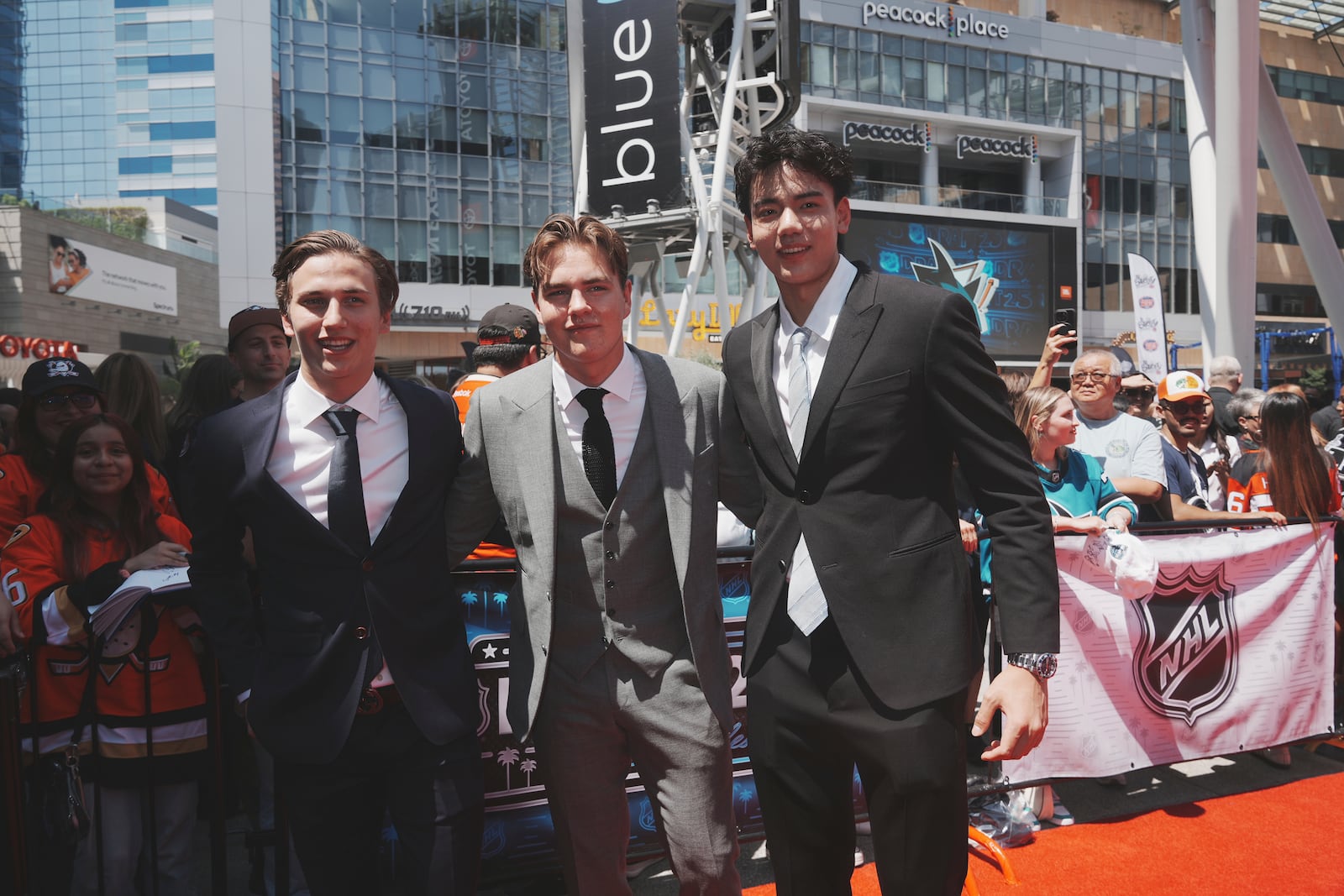 From left, Victor Eklund, Anton Frondell and Simon Wang pose on the red carpet during the NHL hockey draft Friday, June 27, 2025, in Los Angeles. (AP Photo/Damian Dovarganes)