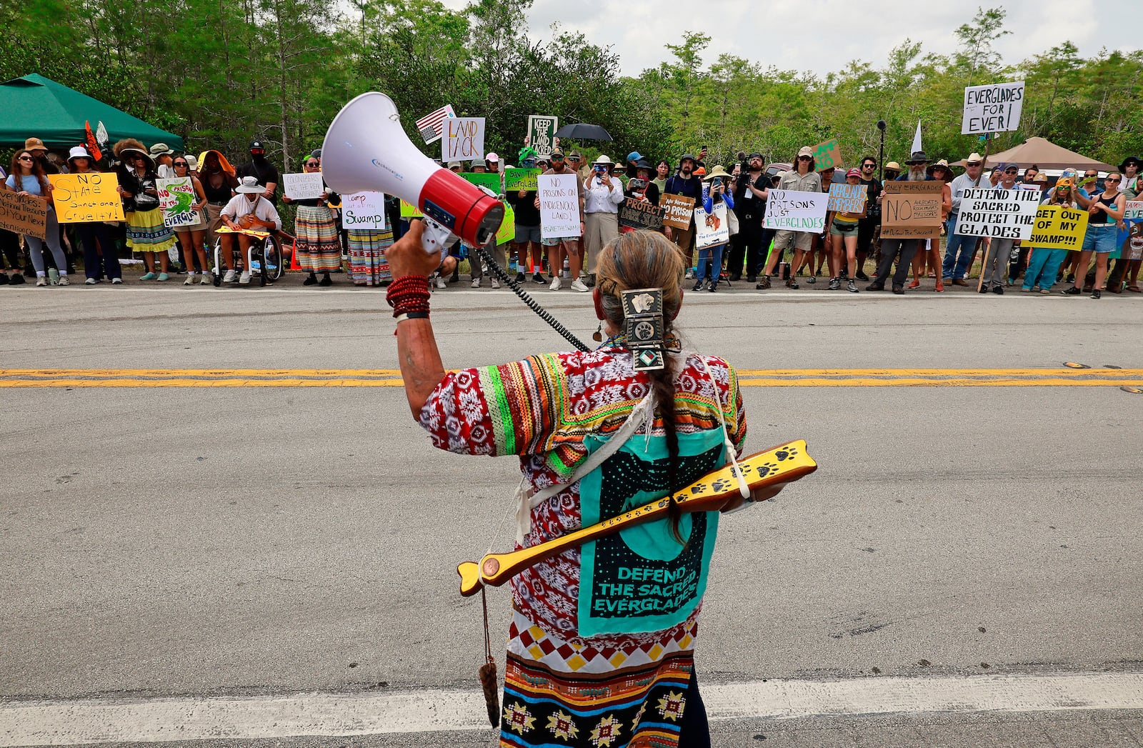 Betty Osceola with the Miccosukee tribe of Indians addresses environmental advocates and other protesters at the Dade-Collier Training and Transition Airport on Tamiami Trail E, Ochopee, Fla.,on Saturday, June 28, 2025. (Mike Stocker /South Florida Sun-Sentinel via AP)