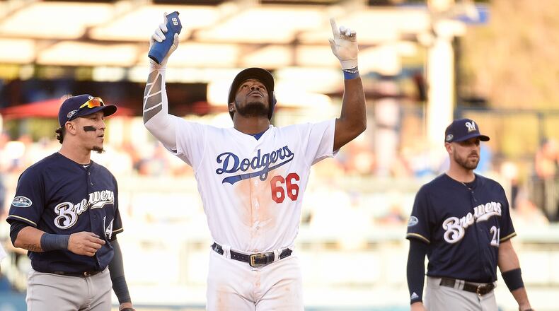 LOS ANGELES, CA - OCTOBER 17: Yasiel Puig #66 of the Los Angeles Dodgers reacts after hitting a double during the eighth inning against the Milwaukee Brewers in Game Five of the National League Championship Series at Dodger Stadium on October 17, 2018 in Los Angeles, California. (Photo by Kevork Djansezian/Getty Images)