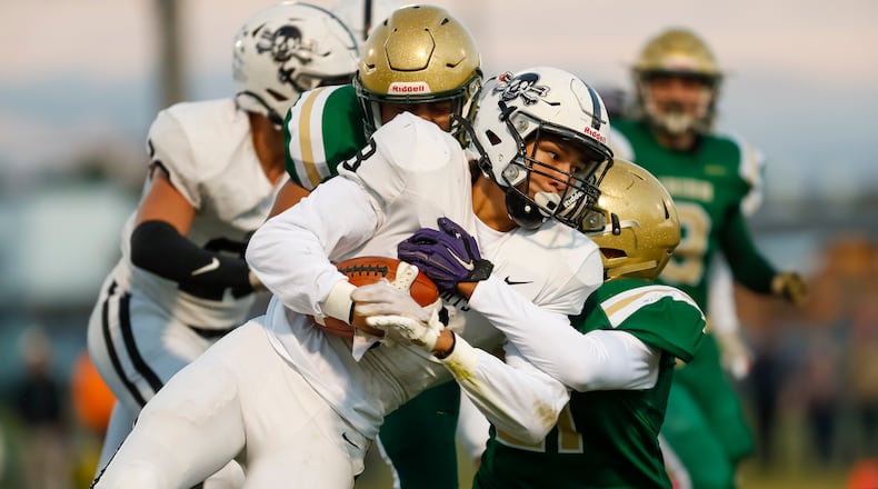 Greenon High School senior Zack Stevens runs the ball during their game against Catholic Central on Friday night at Hallinean Field in Springfield. CONTRIBUTED PHOTO BY MICHAEL COOPER
