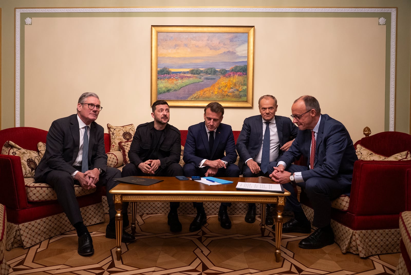 From left, British Prime Minister Keir Starmer, President Volodymyr Zelenskyy, French President Emmanuel Macron, Polish Prime Minister Donald Tusk and German Chancellor Friedrich Merz make a call to U.S. President Donald Trump from Kyiv, Ukraine, on Saturday, May 10, 2025. (AP Photo/Mstyslav Chenov)