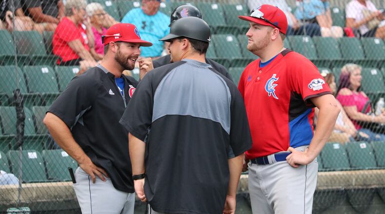 Champion City Kings pitcher Austin Marchant talks with the team’s coaching staff during their game with the Chillicothe Paints on Wednesday, June 27, 2018. Michael Cooper/CONTRIBUTED