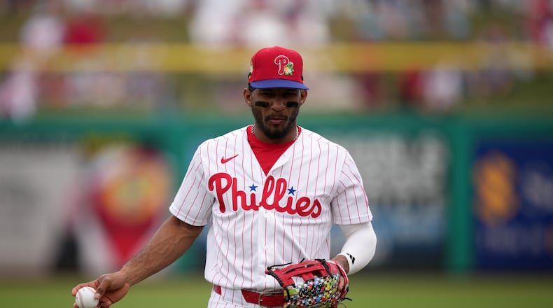 FILE - Philadelphia Phillies' Johan Rojas warms up before a spring training baseball game, Thursday, Feb. 26, 2026, in Clearwater, Fla. (AP Photo/Matt Slocum, File)