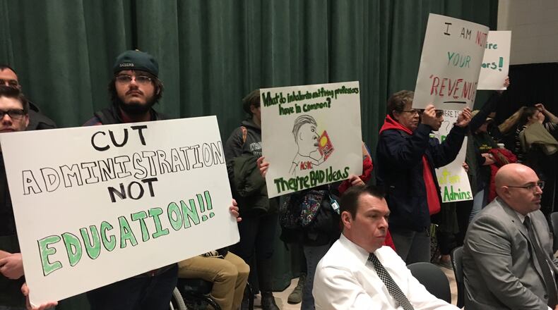 Wright State University students protested on Friday, April 7, 2017, during a board of trustees meeting. Students held signs that read “Cut Administration Not Education.” Another protest is planned for the May 19 finance committee meeting. JOSH SWEIGART / STAFF