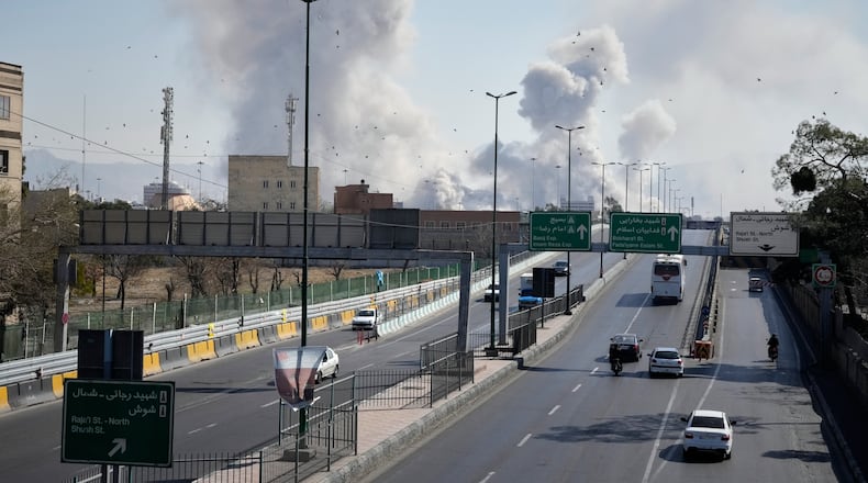Plumes of smoke rise as strikes hit the city during the U.S.–Israeli military campaign in Tehran, Iran, Thursday, March 5, 2026. (AP Photo/Vahid Salemi)