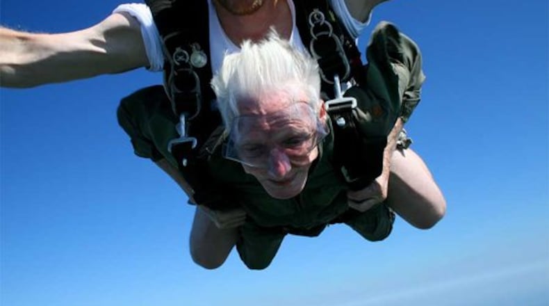 Archive photo July 12, 2010: Jim Martin, then 89 and of Sugarcreek Twp., jumped into the night sky over France as a young man in the 101st Airborne on D-Day, dodging anti-aircraft fire and enemy radar at a mere 400 feet. On Sunday, July 11, Martin took a leap hooked to Bob Tyson, a jump master at Skydive Greene County from a safer 12,500 feet.