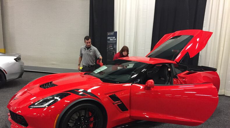 Lighting up the Dayton Auto Show in Torch Red is the 2018 Chevrolet Corvette Grand Sport Coupe, with an MSRP of more than $73,000. AMY ROLLINS / STAFF