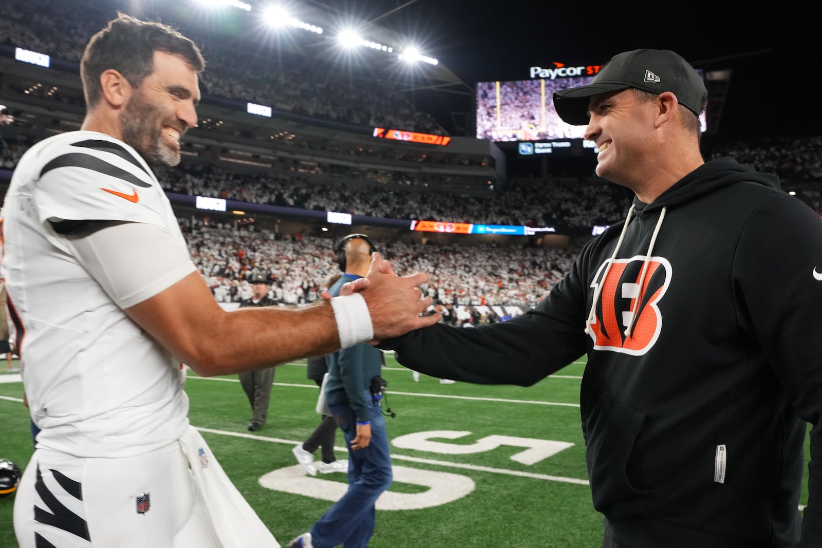 Cincinnati Bengals quarterback Joe Flacco, left, celebrates with head coach Zac Taylor after an NFL football game against the Pittsburgh Steelers in Cincinnati Thursday, Oct. 16, 2025. (AP Photo/Jeff Dean)