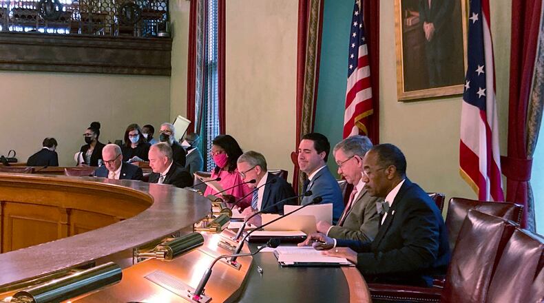 Members of the Ohio Redistricting Commission – from left, Senate President Matt Huffman, Auditor Keith Faber, House Minority Leader Emilia Sykes, Gov. Mike DeWine, Secretary of State Frank LaRose, House Speaker Bob Cupp and Sen. Vernon Sykes – pictured at the Ohio Statehouse in Columbus, Ohio, during their first meeting on Aug. 6, 2021. (AP Photo/Julie Carr Smyth)