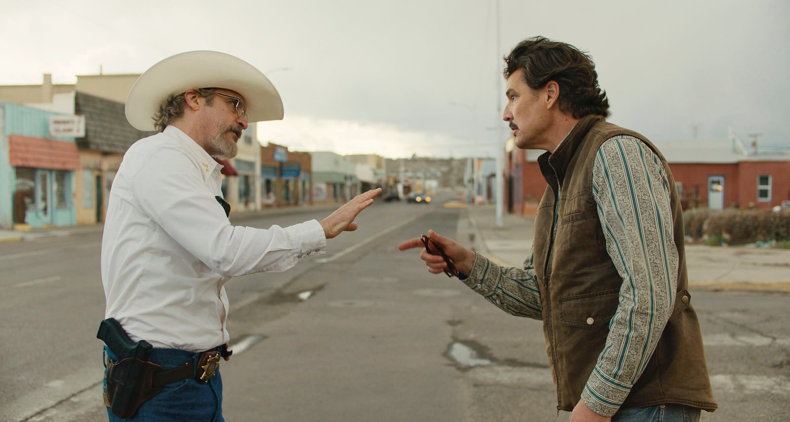 This image released by A24 shows Joaquin Phoenix, left, and Pedro Pascal in a scene from "Eddington." (A24 via AP)
