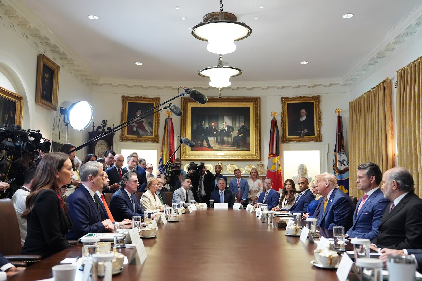 President Donald Trump, right seated, speaks during a cabinet meeting at the White House, Tuesday, July 8, 2025, in Washington. (AP Photo/Evan Vucci)