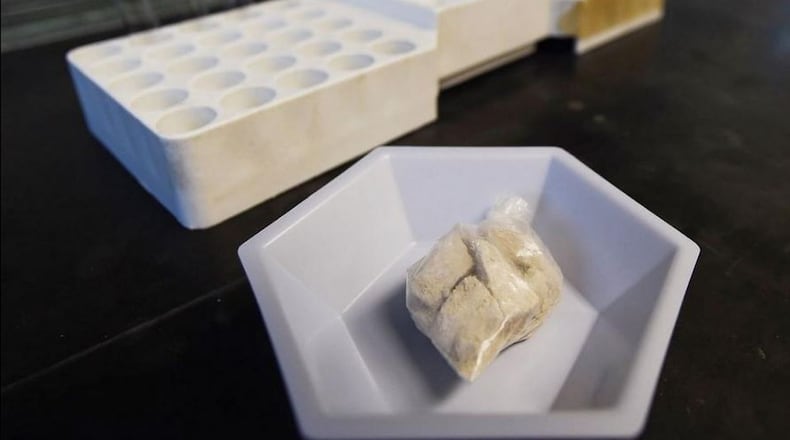 The drug “gray death” lies in a dish at the crime lab of the Georgia Bureau of Investigations. Investigators who nicknamed the mixture have detected it, or recorded overdoses blamed on it, in Ohio, Alabama and Georgia. (AP Photo/Mike Stewart)