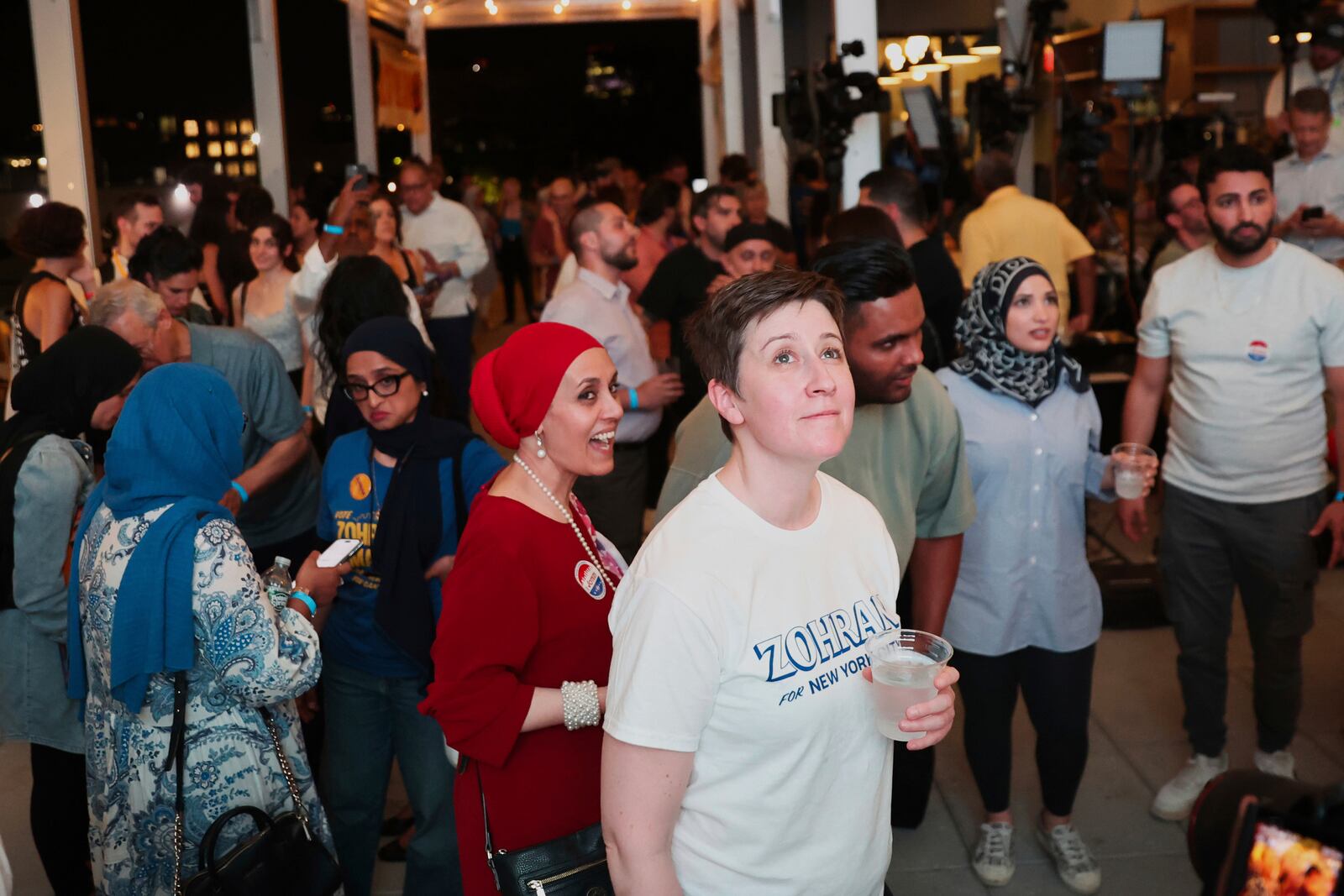 Supporters of Democratic mayoral candidate Zohran Mamdani watch results come in at his primary election party, in New York, Tuesday, June 24, 2025. (AP Photo/Heather Khalifa)