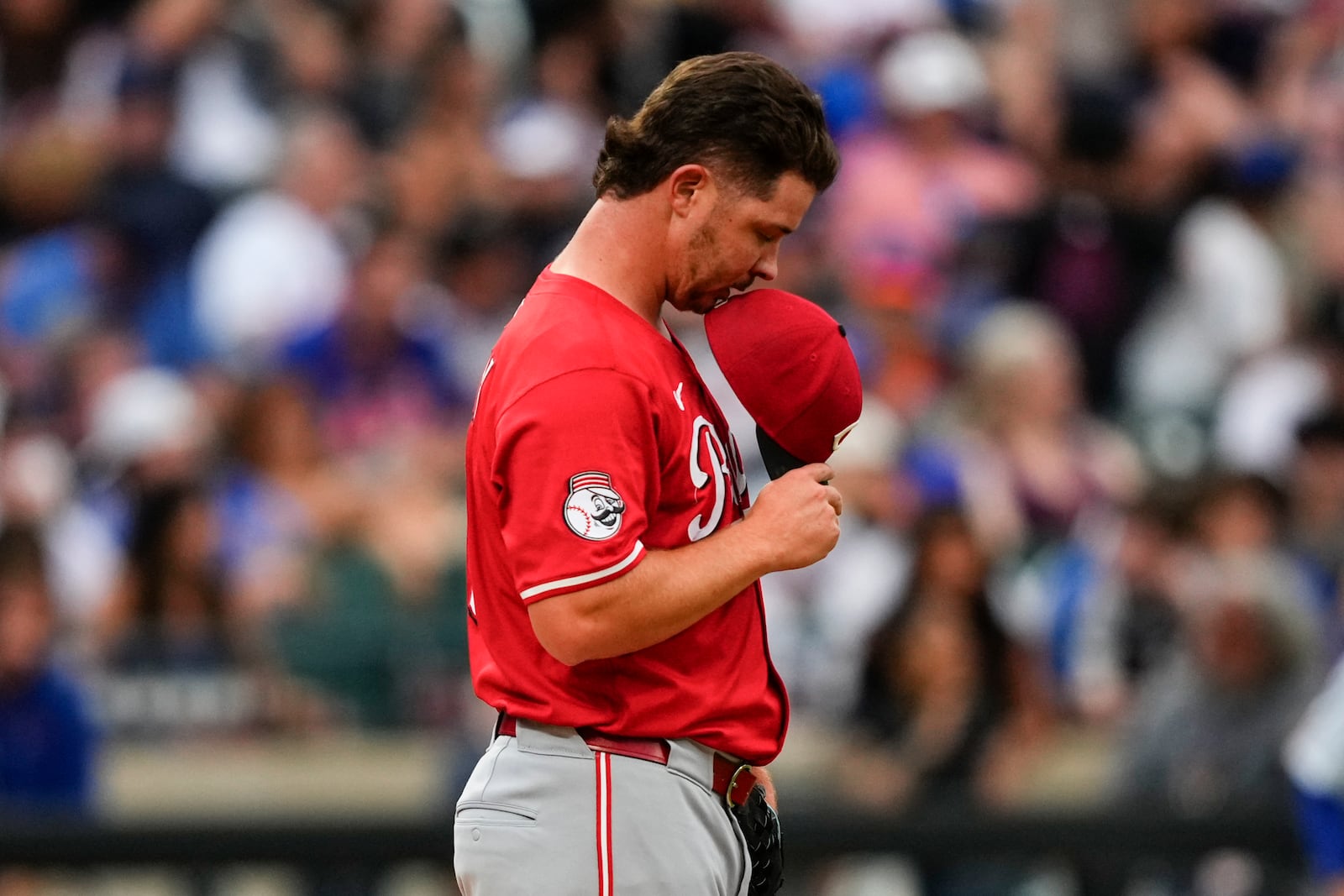 Cincinnati Reds pitcher Emilio Pagán pauses during the ninth inning of a baseball game against the New York Mets, Saturday, July 19, 2025, in New York. (AP Photo/Yuki Iwamura)