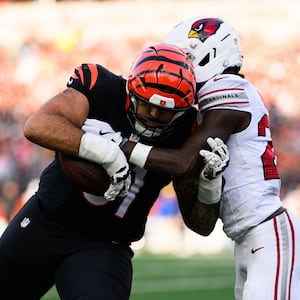 Bengals offensive lineman Cody Ford completes a catch and run in the third quarter during their game against the Arizona Cardinals on Sunday, Dec. 28, at Paycor Stadium. JEREMY MILLER / CONTRIBUTED PHOTO
