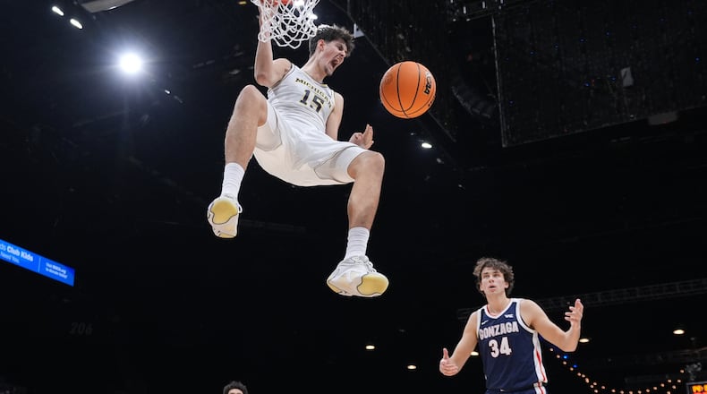 Michigan center Aday Mara (15) reacts as he scores against Gonzaga during the first half of an NCAA college basketball game in the Players Era tournament in Las Vegas, Wednesday, Nov. 26, 2025. (AP Photo/Eric Gay)